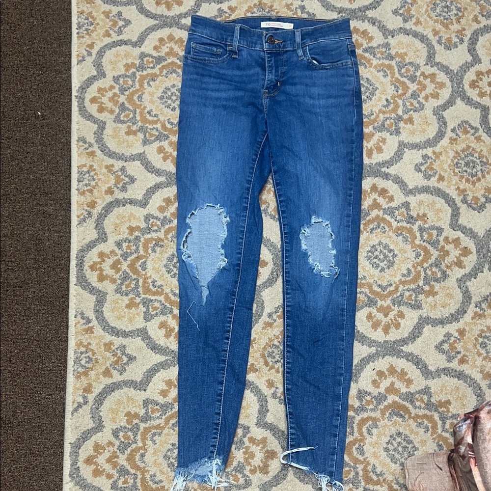 Levi’s 710 super skinny blue distressed jeans